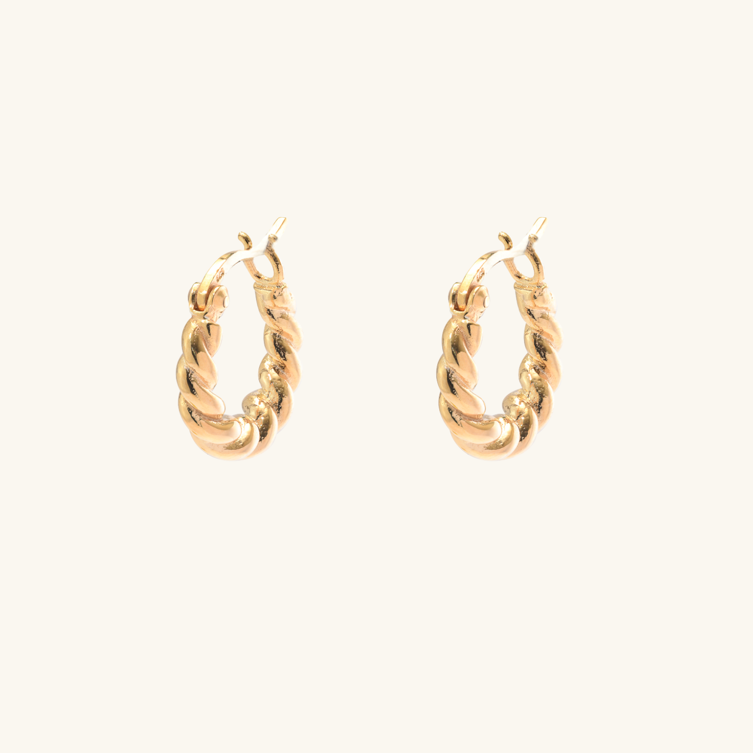 Croissant_Dome_earrings_Front view on cream background