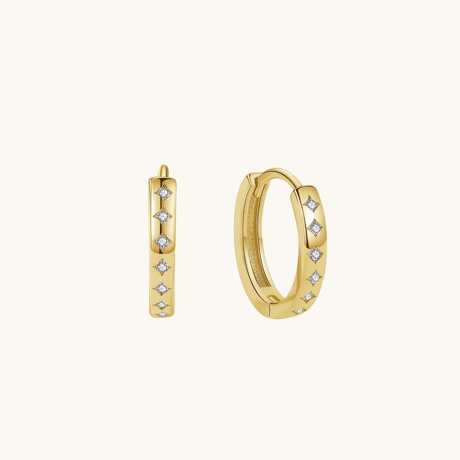 Everyday_CZ_huggie_earrings on cream background