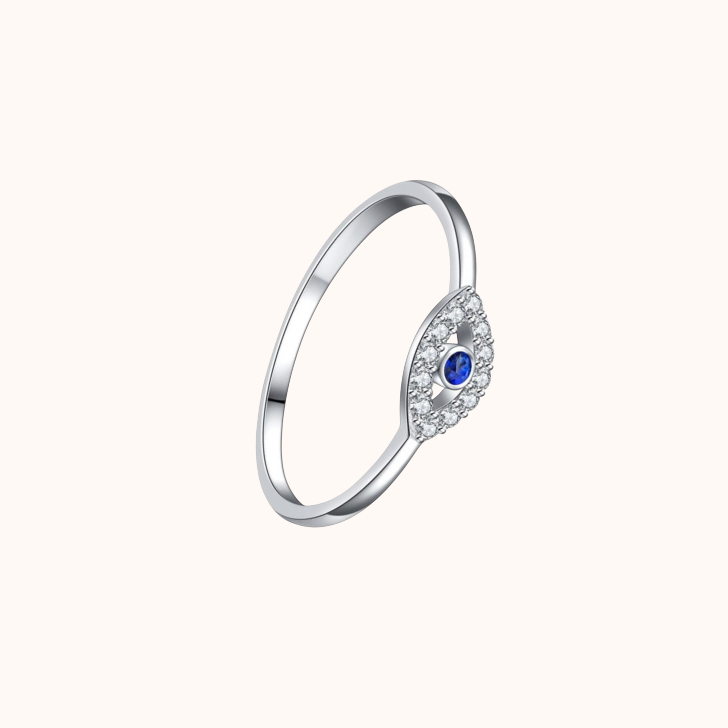 Silver Evil Eye ring with a blue gemstone on a white background