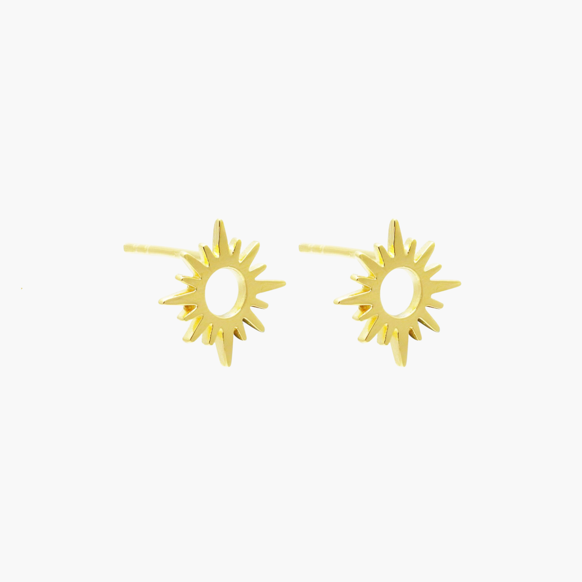 A pair of gold sunburst stud earrings on a plain white background.