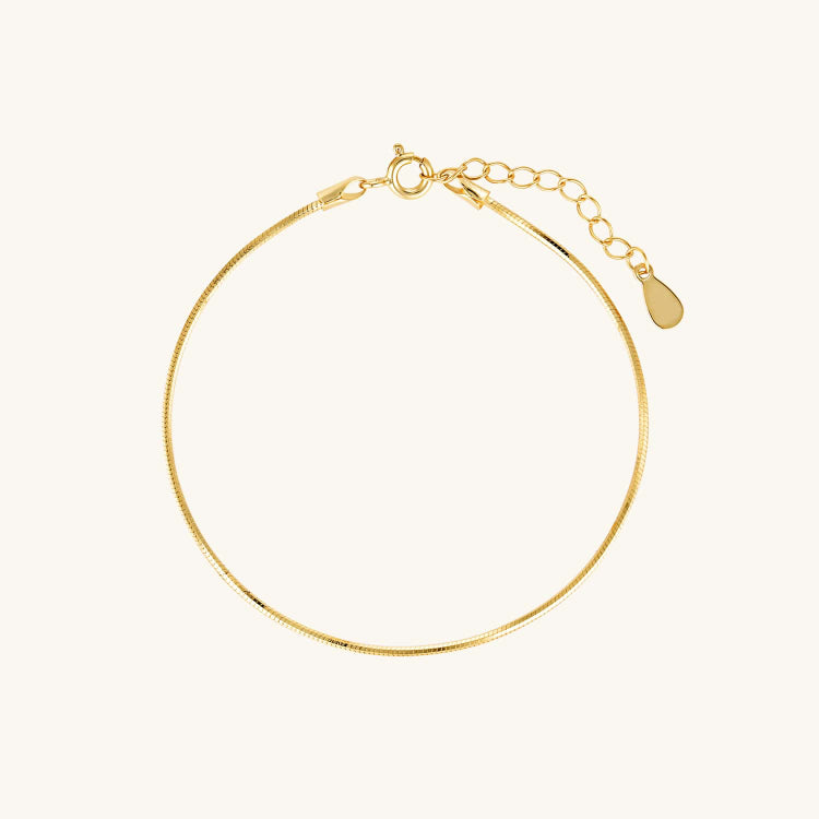 Elegant gold coil bracelet with a sleek, polished finish, designed for a bold yet timeless look—perfect for any occasion