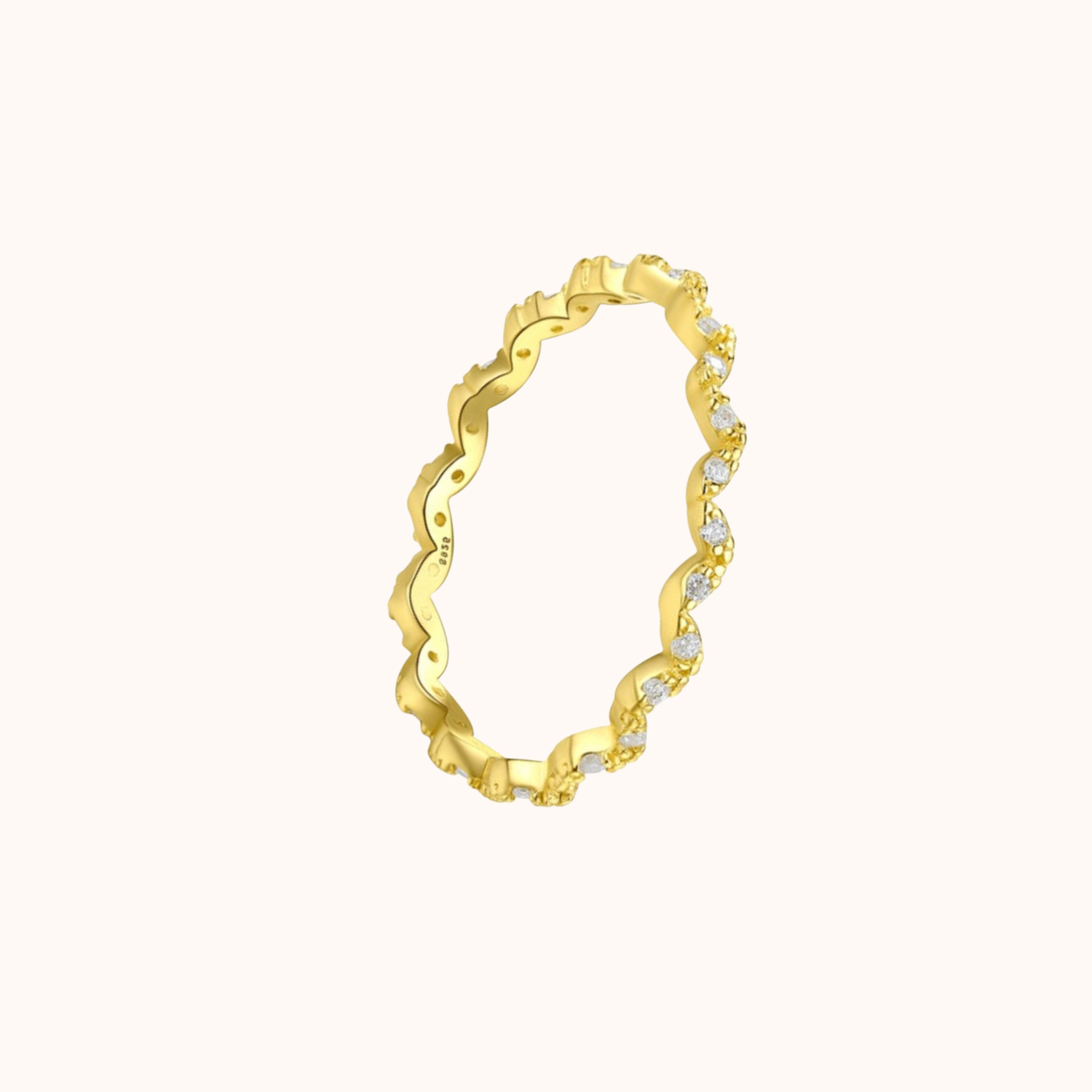 golden ring on cream background