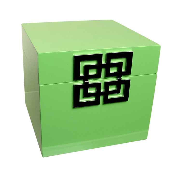 Elegant green piano finish jewellery box with a silver decorative emblem on the front, displayed on a white background