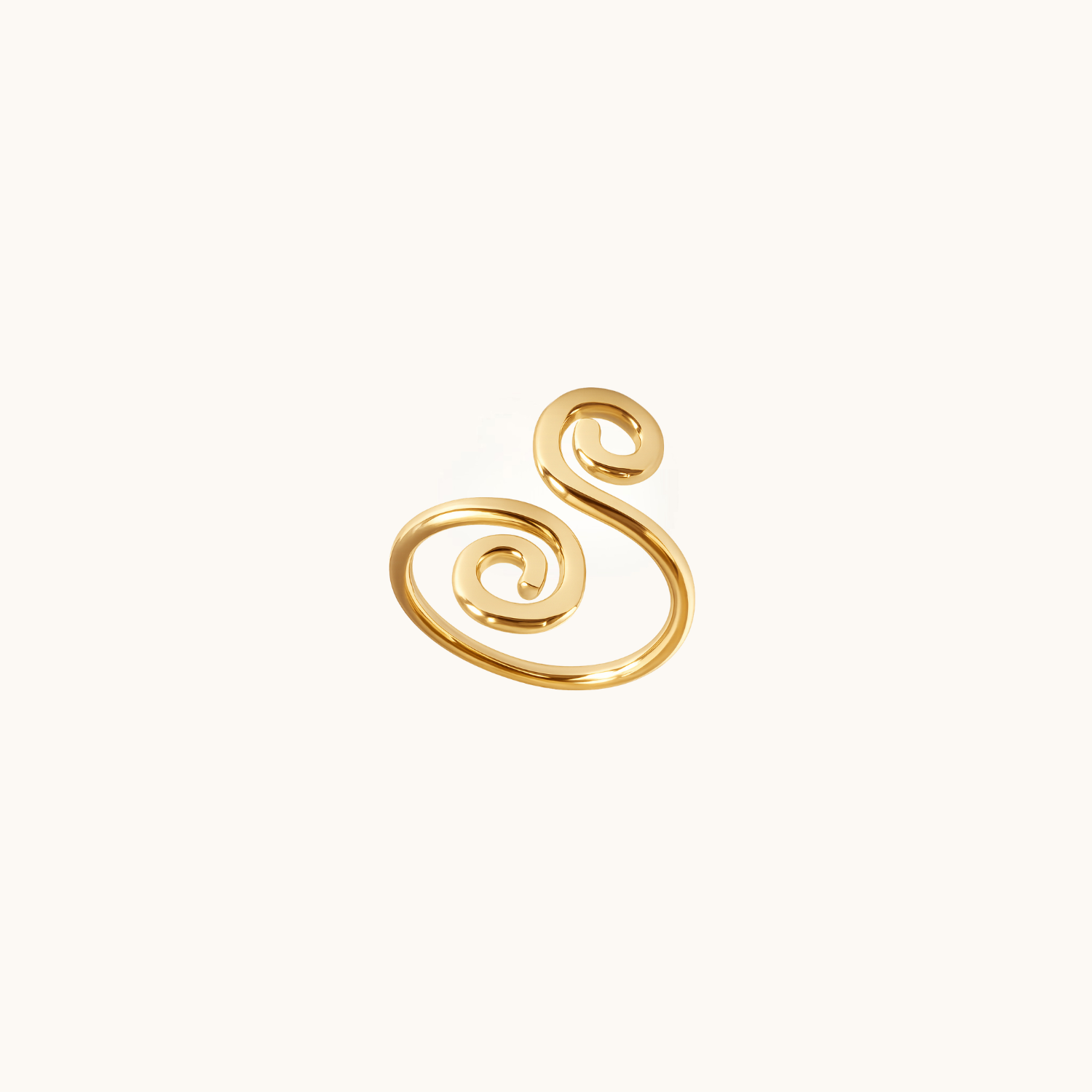 Gold swirl toe ring on a white background