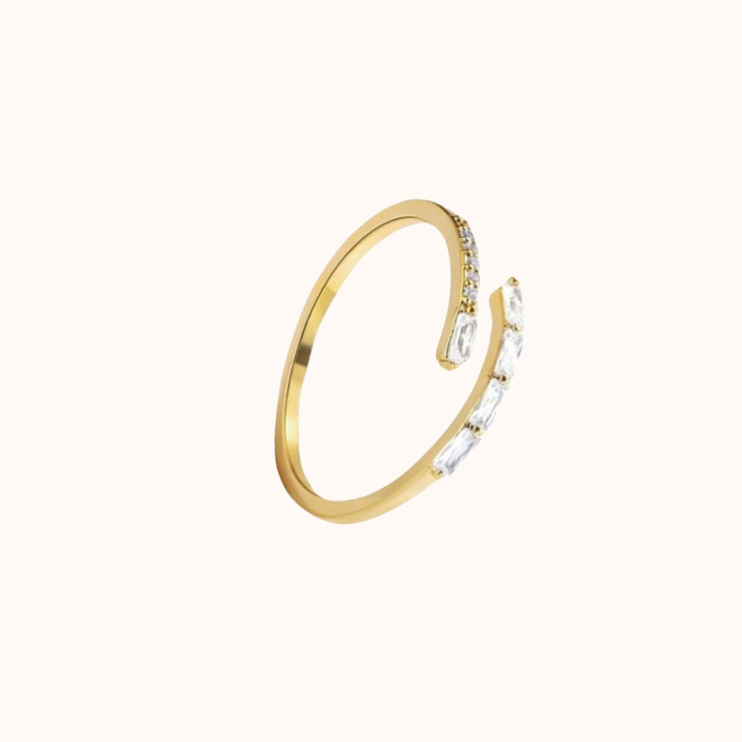 Gold ring with embedded crystals on a white background