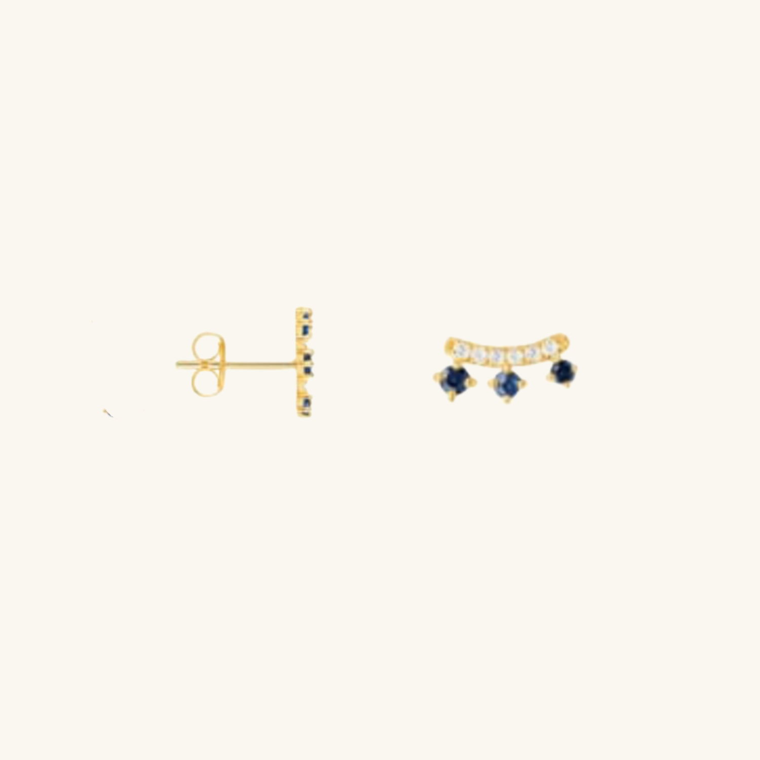 Gold earrings with Cubic Zirconia on a white background