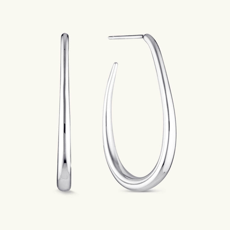 Silver Halo Hoops with a high-shine finish and classic loop design, offering a modern yet timeless look perfect for everyday wear or special occasions