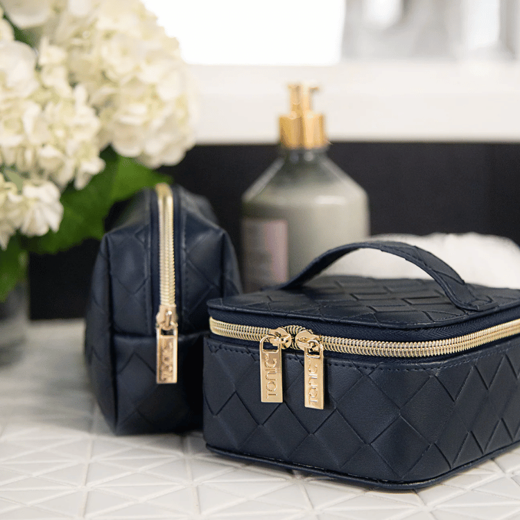 Navy woven cube jewellery holder elegantly placed on a dressing table