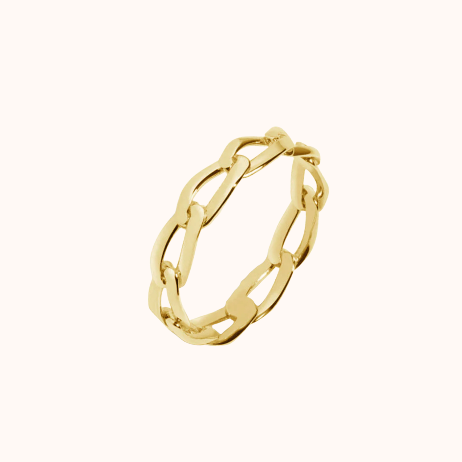 Gold link ring on cream background