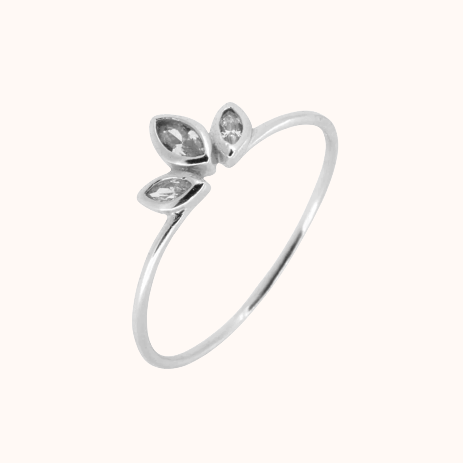 Silver ring with three teardrop-shaped gemstones on a white background
