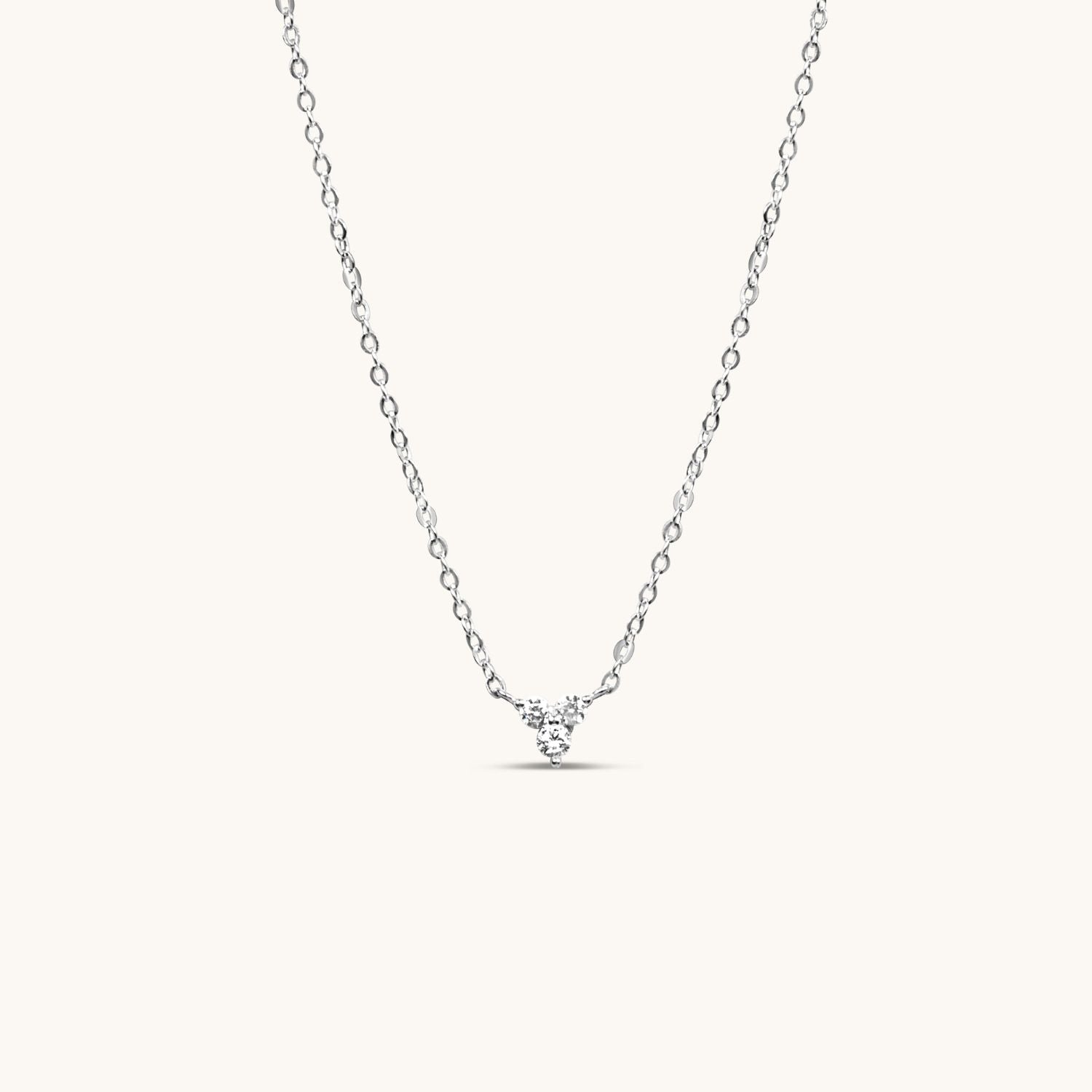 Silver lotus flower necklace with shimmering cubic zirconia, symbolizing purity and elegance. A delicate, timeless piece perfect for any occasion