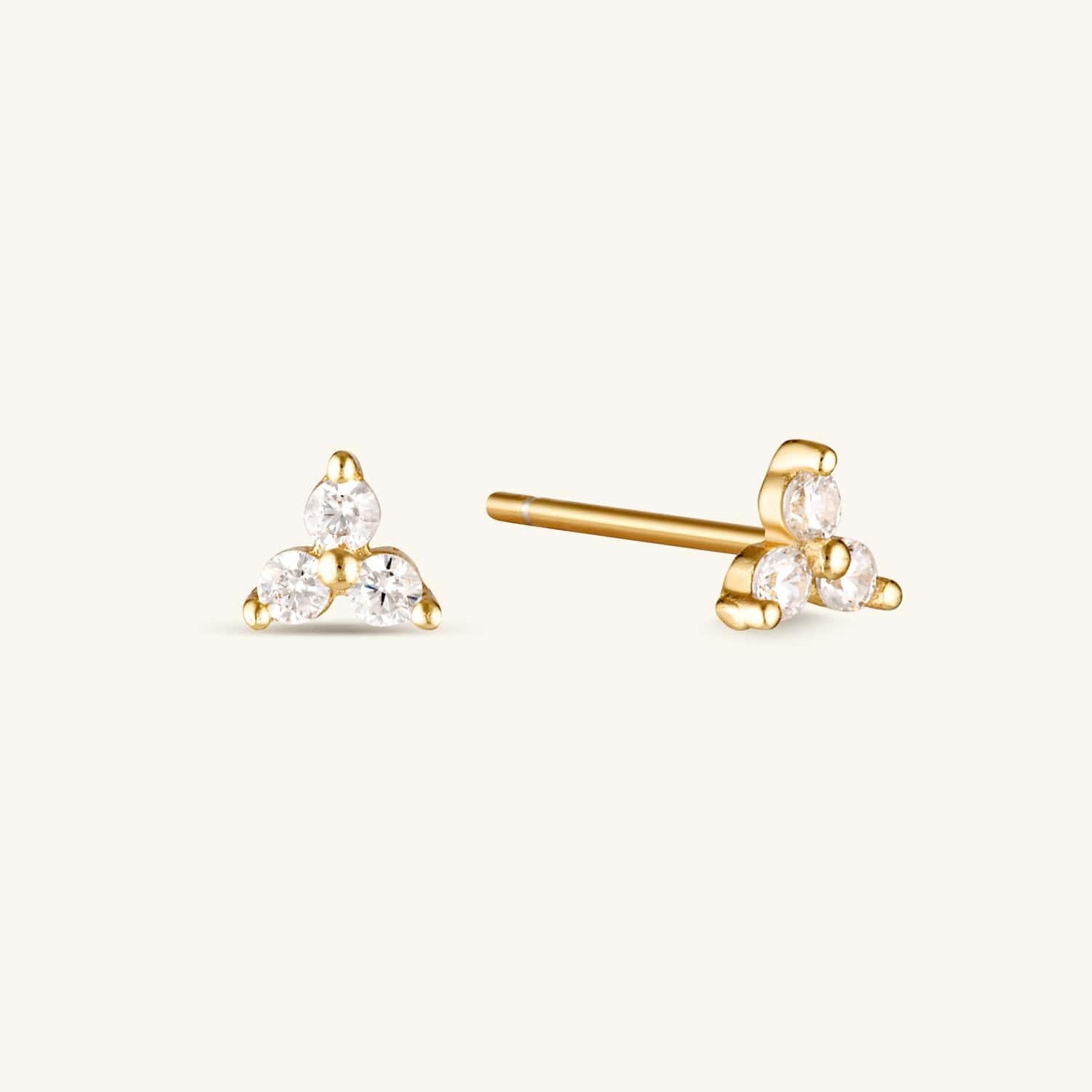 Gold lotus cubic zirconia earrings with a delicate floral design, featuring sparkling stones for an elegant and timeless look