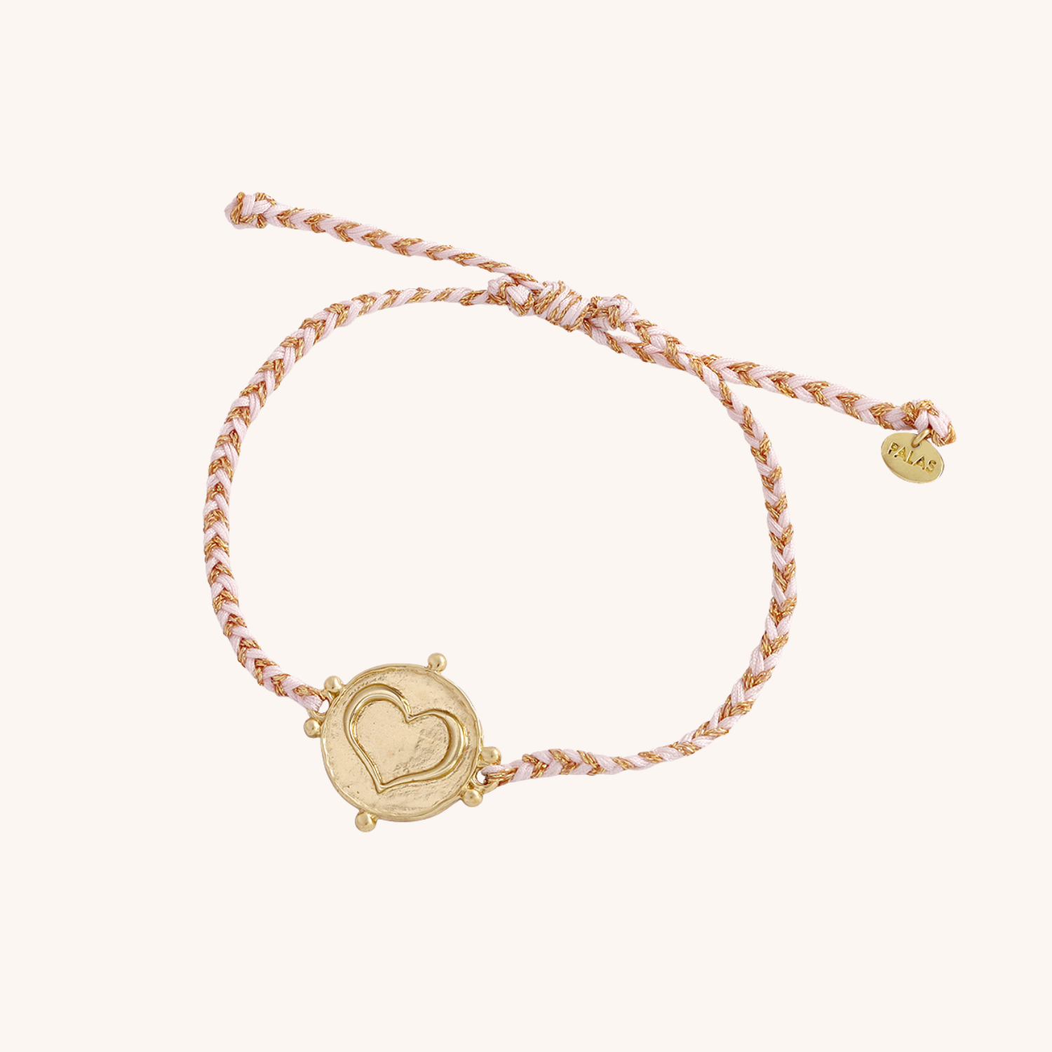Bracelet with heart-shaped charm on a white background