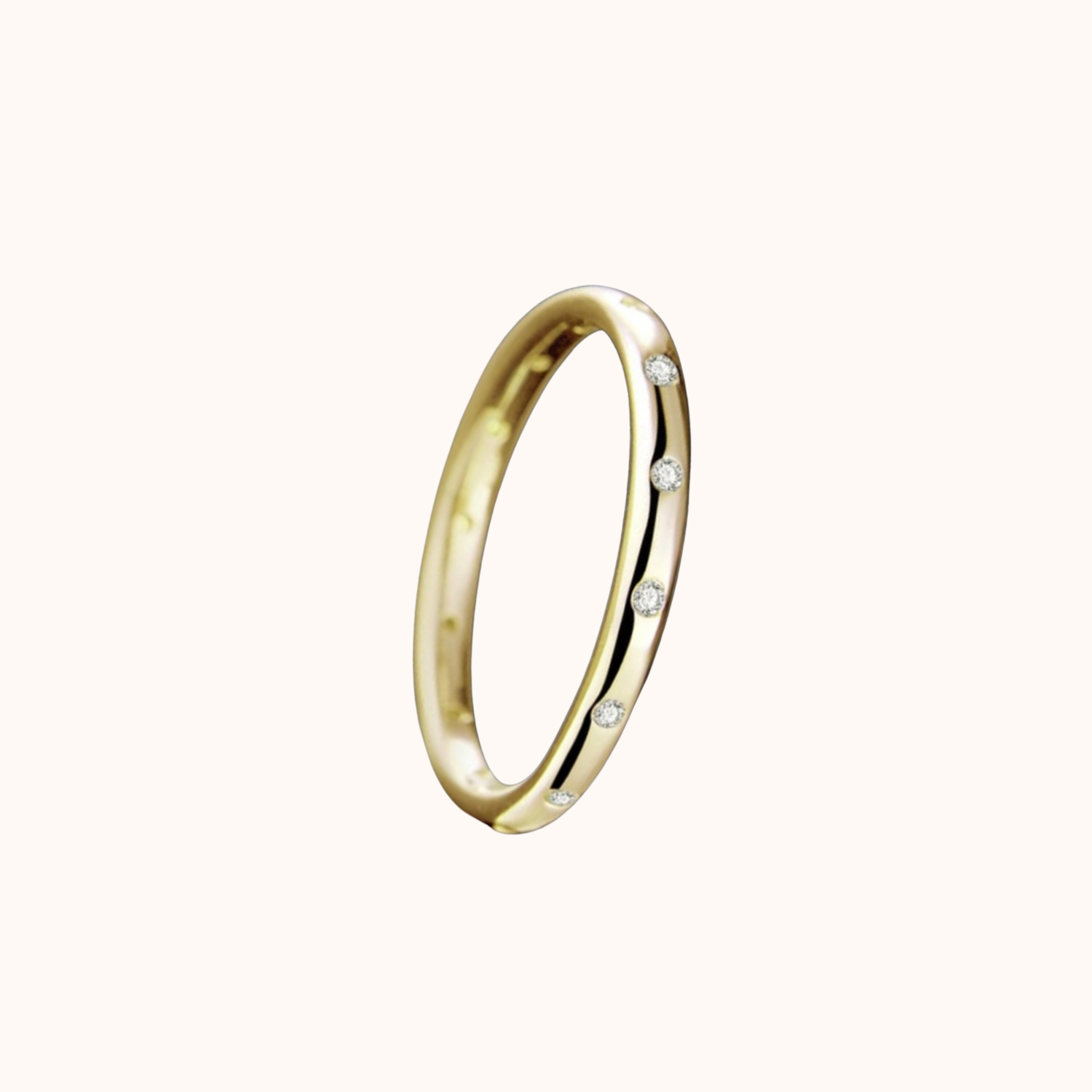 Gold ring with small cubic zirconia on a white background