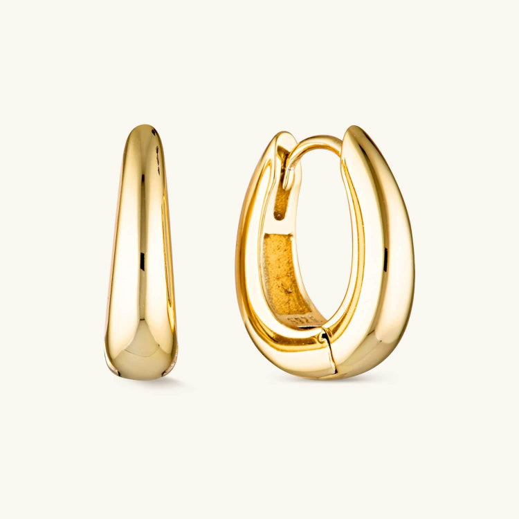 Gold Luxe Bold Hoops with a thick, high-shine design. A statement hoop earring that adds elegance and confidence to any look