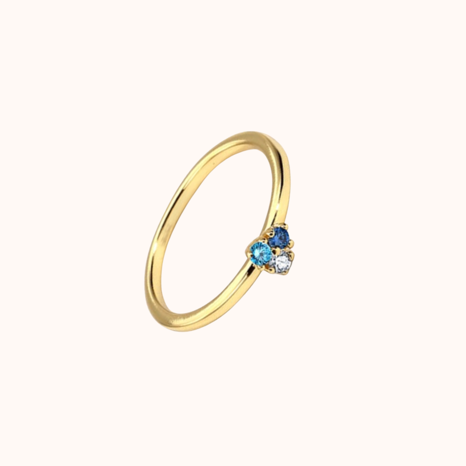 Blue Cubic zirconia ring on cream background