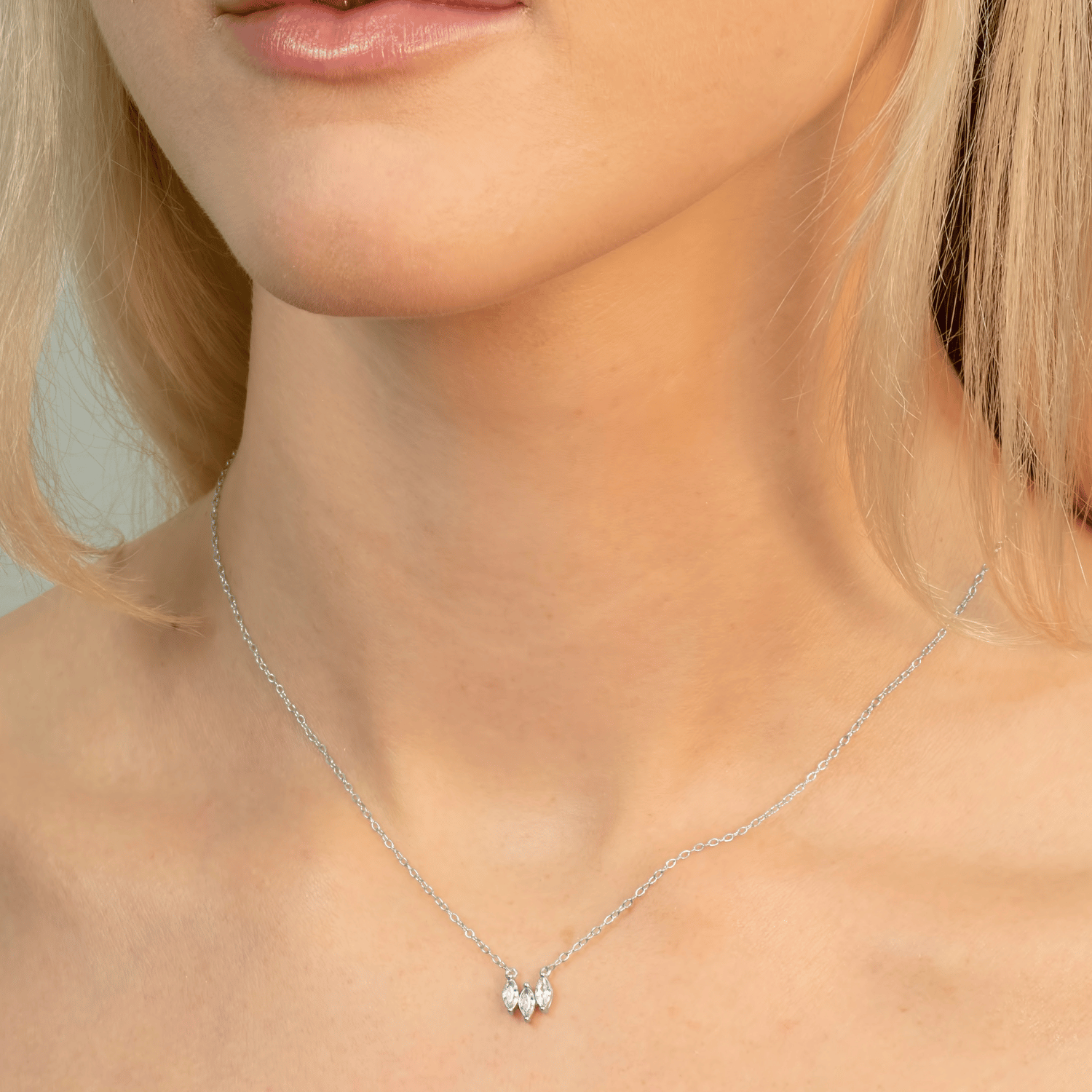 Elevate your look with the Three Tear cubic zirconia necklace in silver. Featuring three dazzling teardrop stones, it's elegant, timeless, and versatile