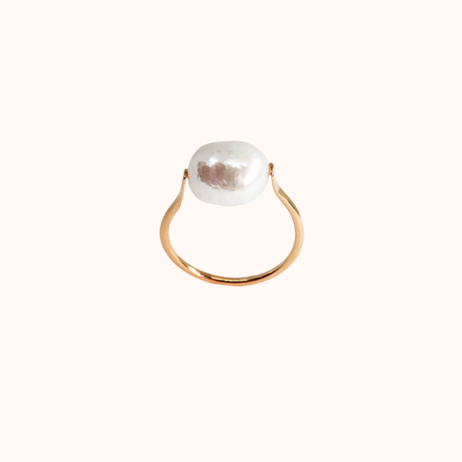 Rose Gold ring with a large pearl on a white background