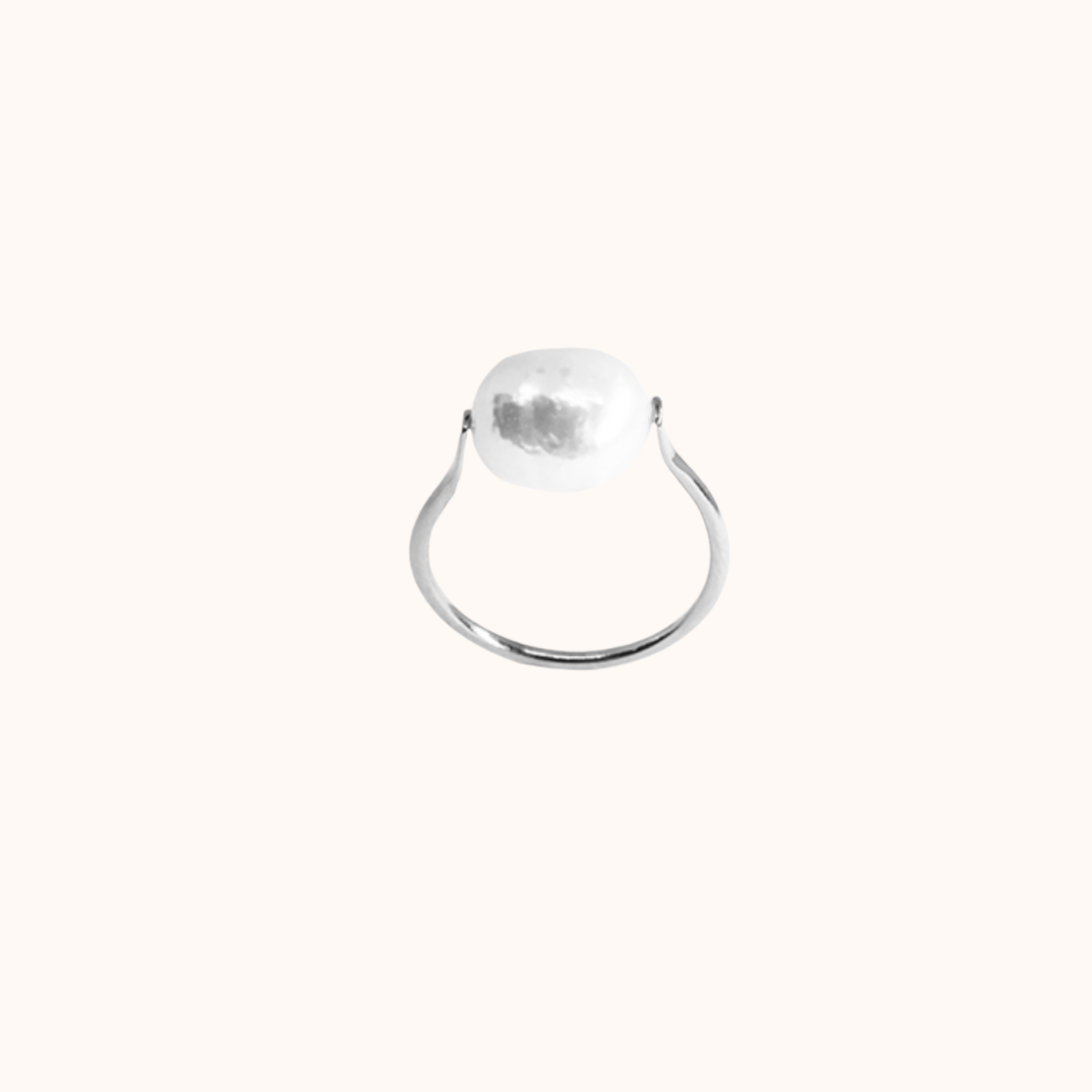 Silver ring with a large pearl on a white background