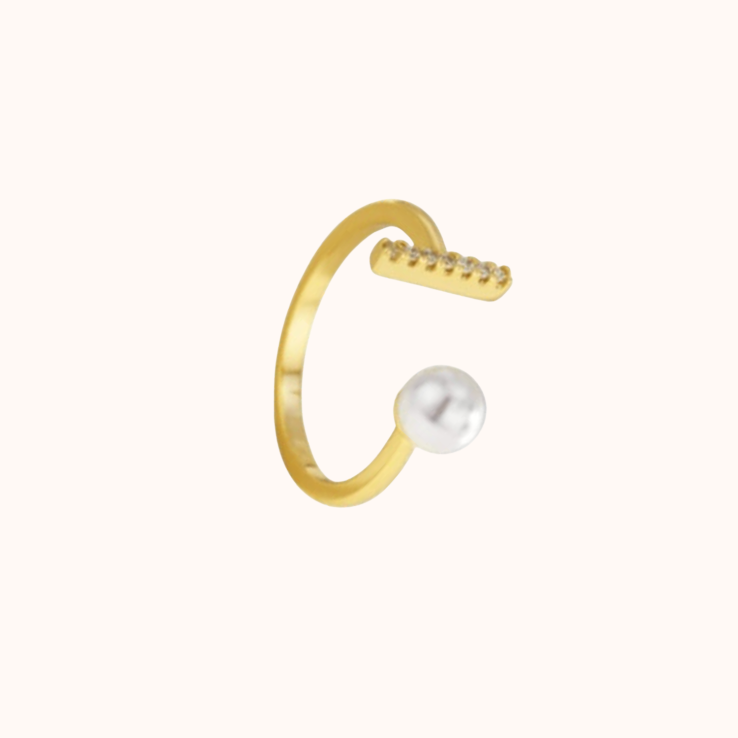 Gold ring with a pearl on a white background