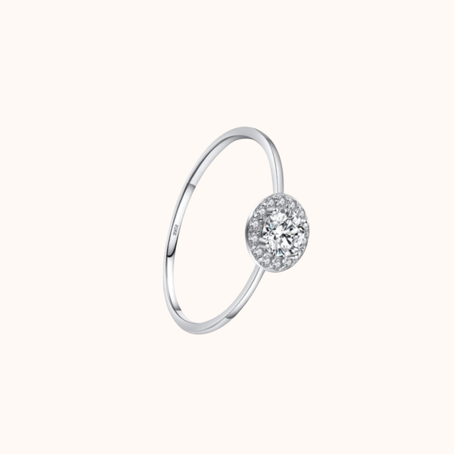 Silver ring with a cubic zirconia on a white background