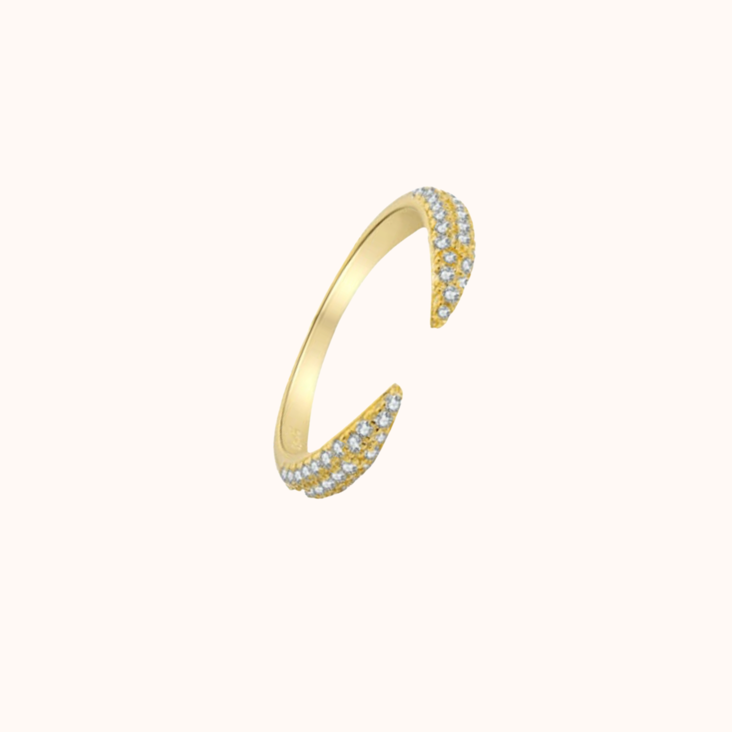 Gold Ring with embedded stones on a white background