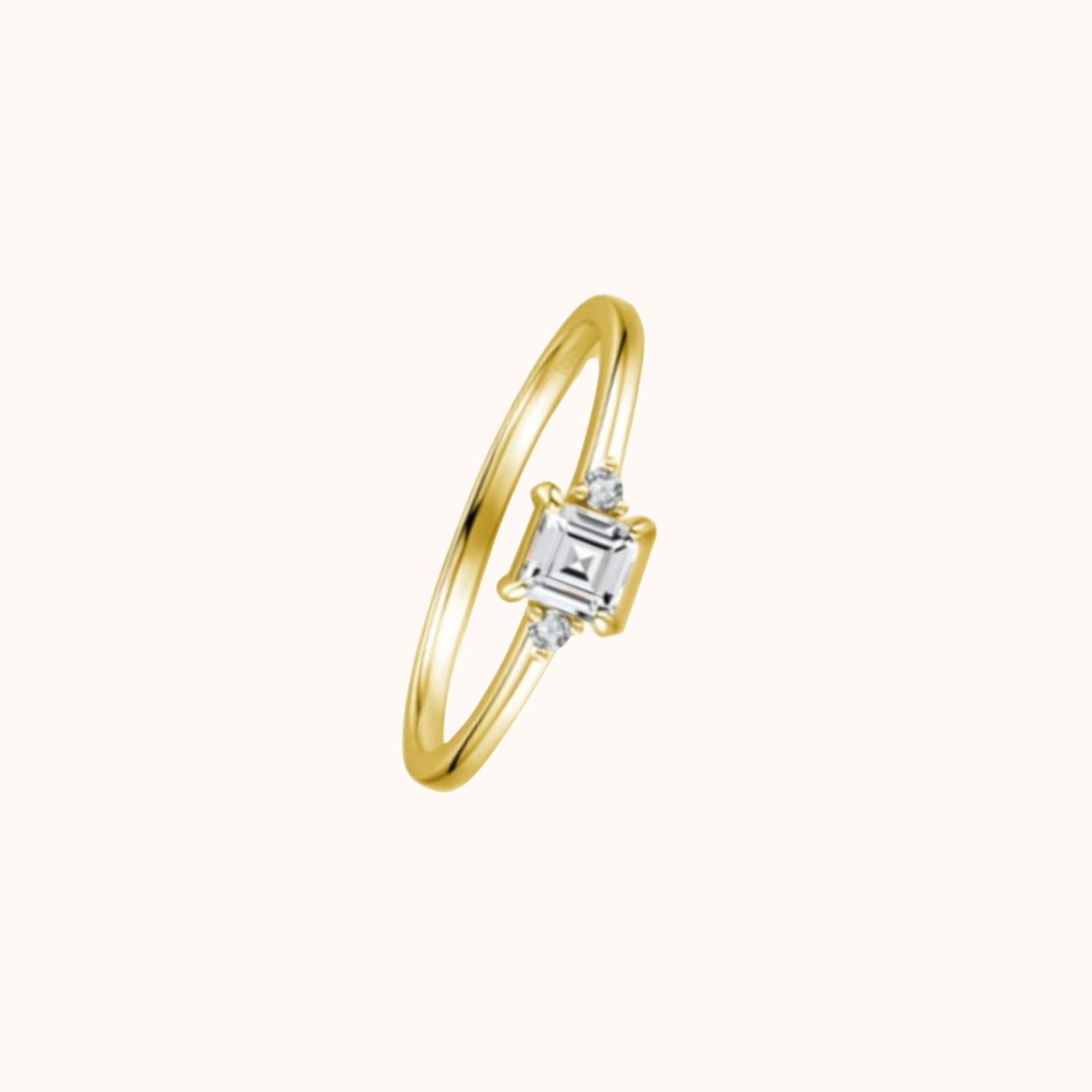 Gold ring with a CZ on a white background