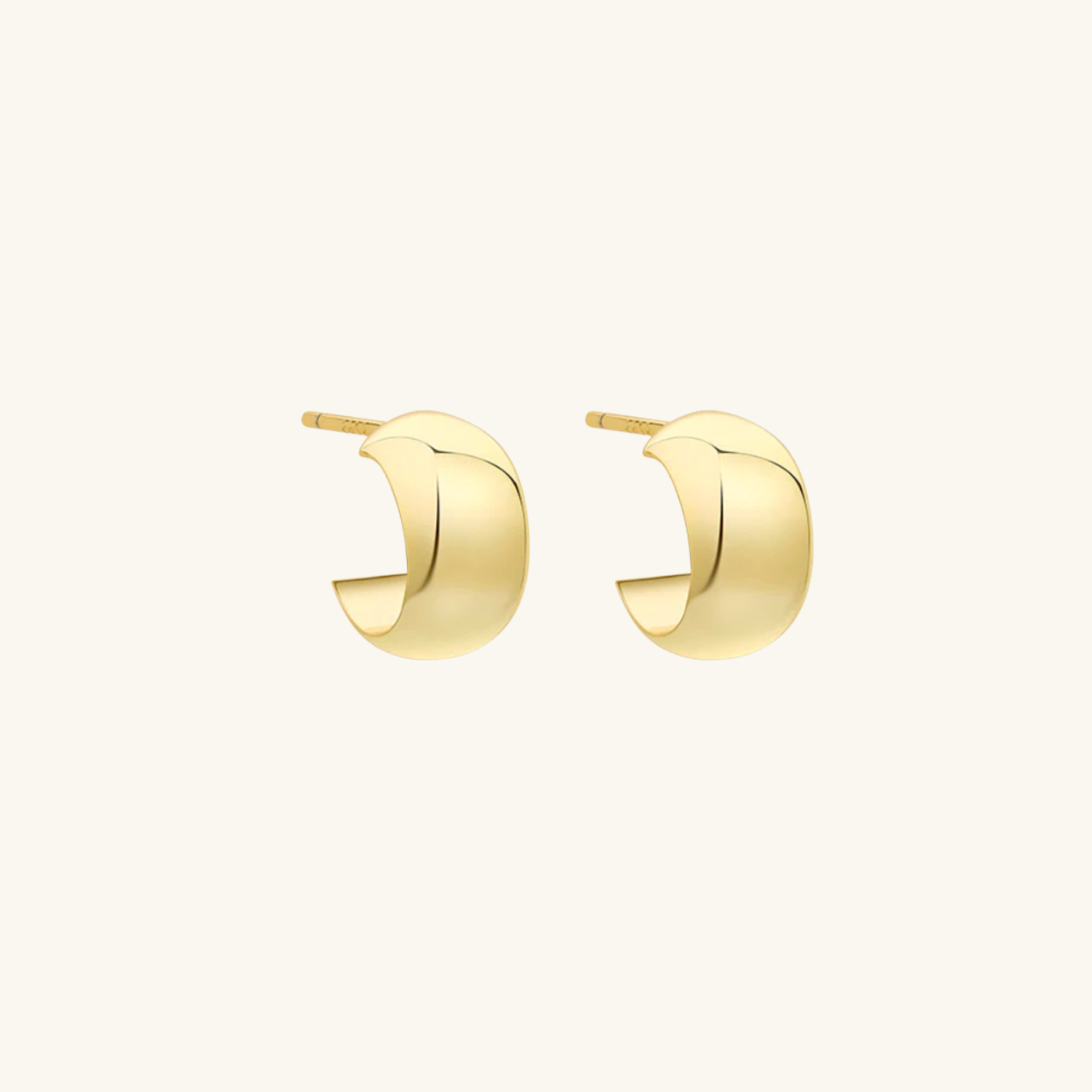 Gold hoop earrings on a white background
