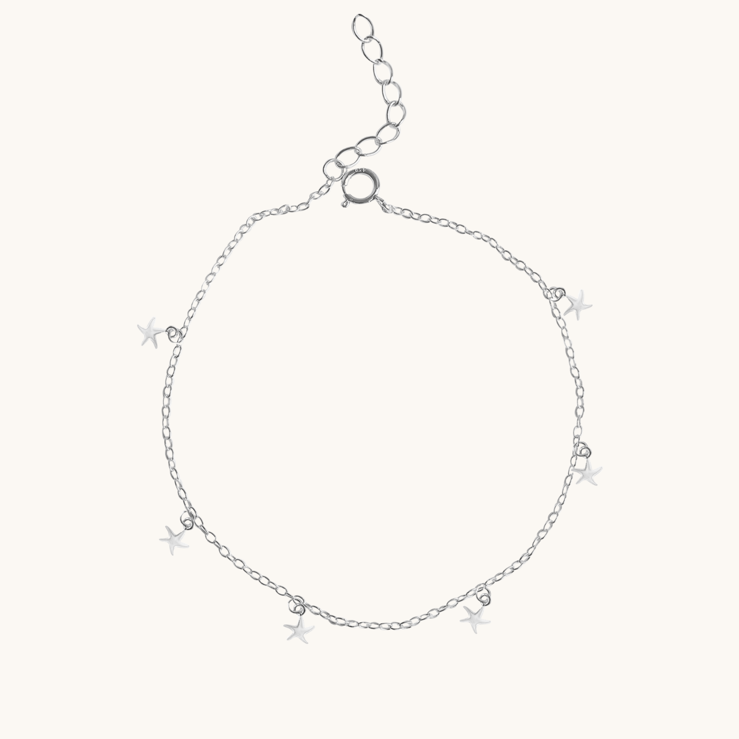 Silver chain anklet with star-shaped charms on a white background