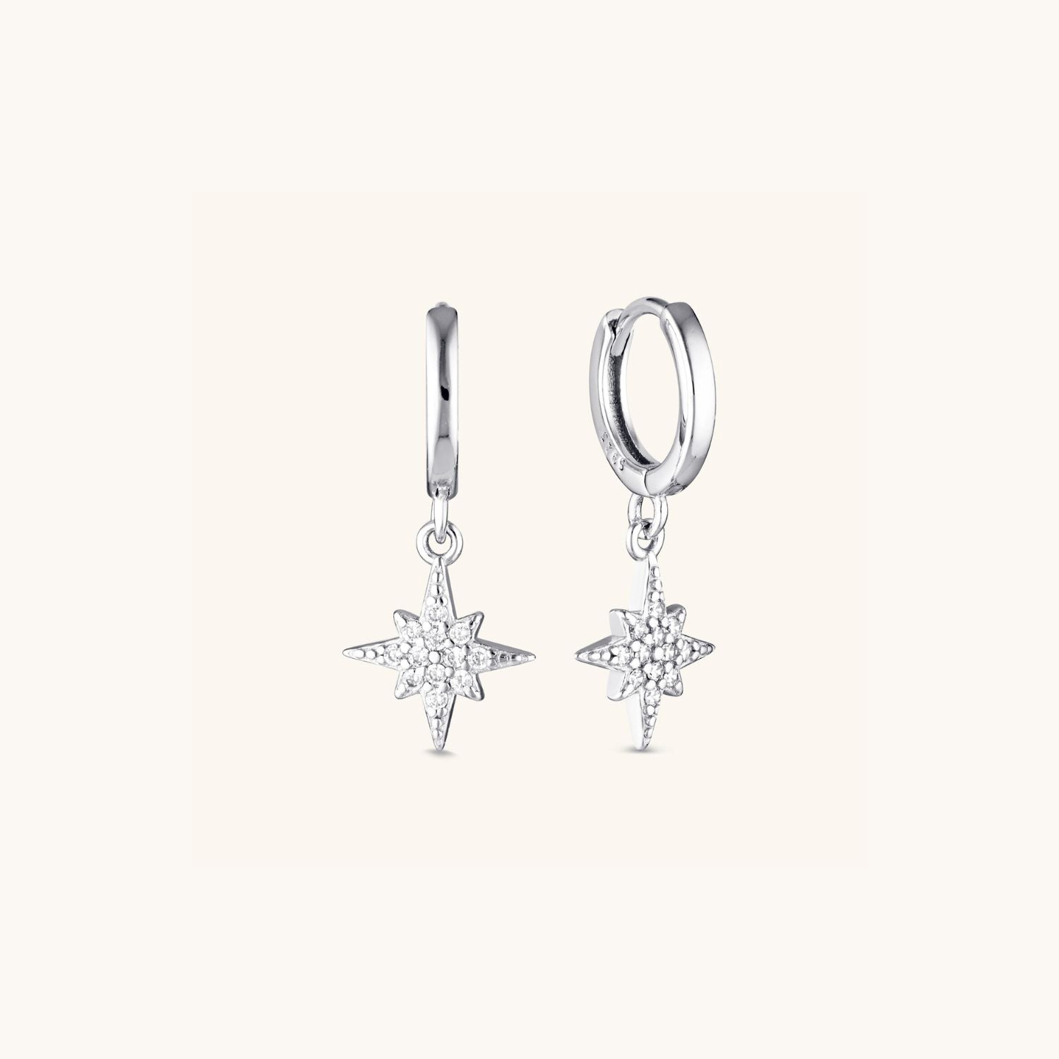 Silver Stellar Huggie Earrings with a delicate star drop, crafted in sterling silver for a celestial-inspired, elegant everyday look
