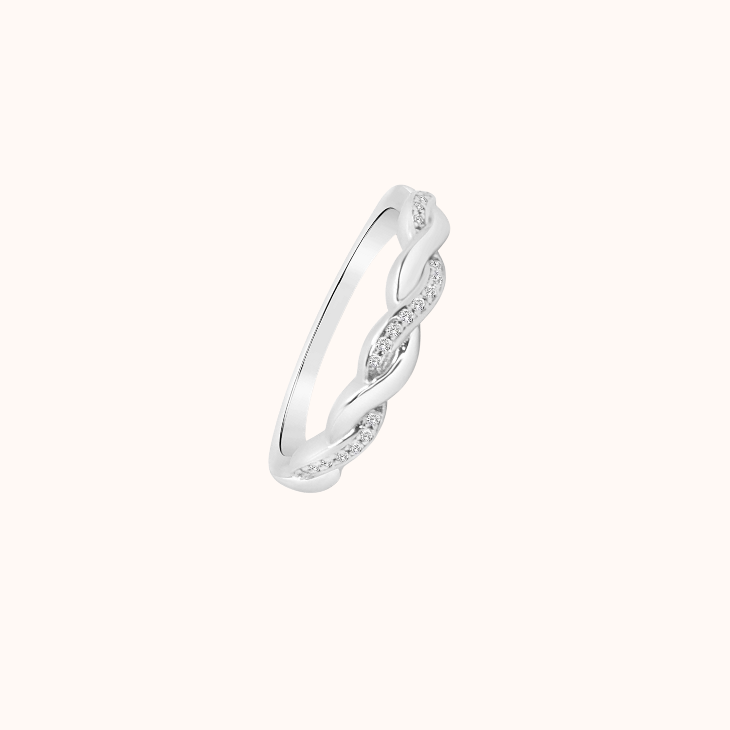 Silver ring with a twisted design on a white background