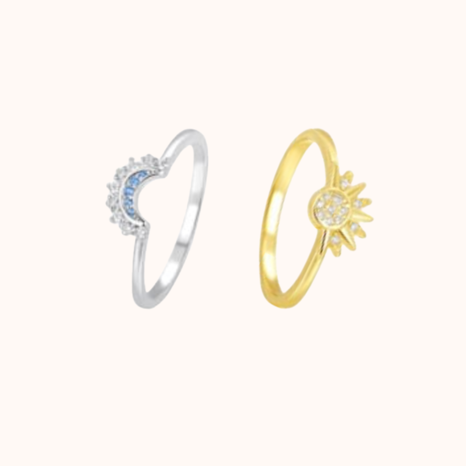Two rings, one silver and one gold, on a white background