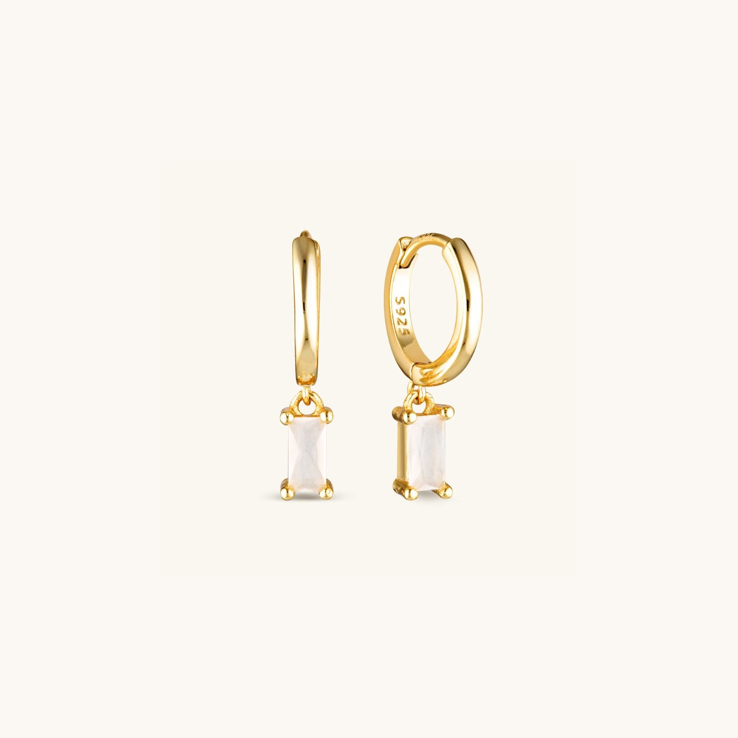 Zephyr Huggie Earrings with a sleek geometric drop design made in sterling silver with gold plating. A modern statement piece with effortless movement