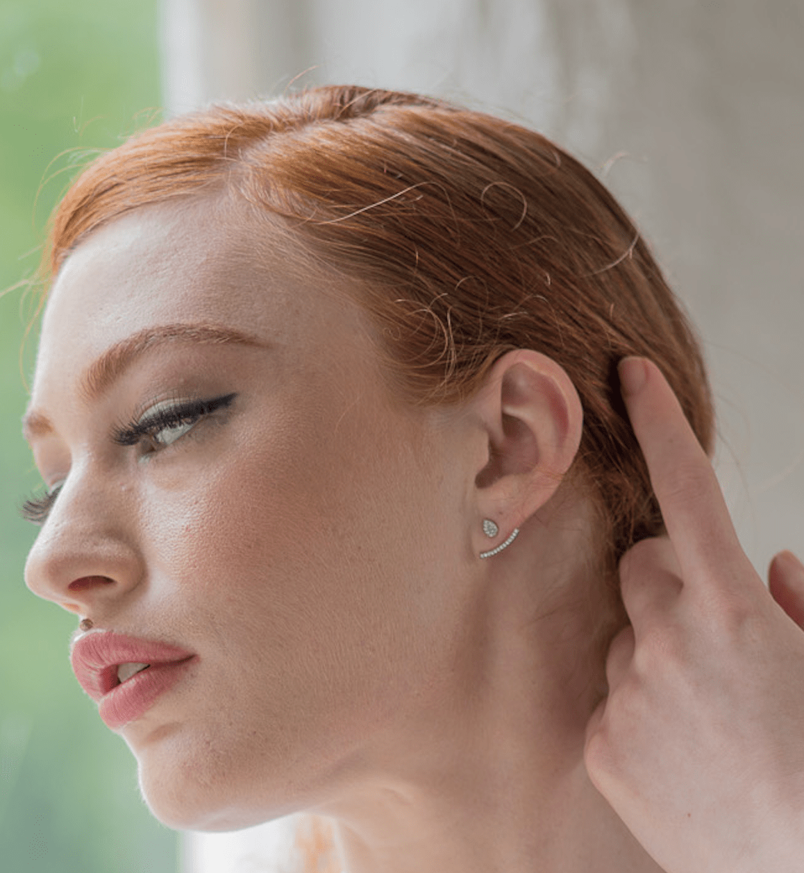 model-wearing-tear-drop-earring-with-cubic-zirconia-cuff