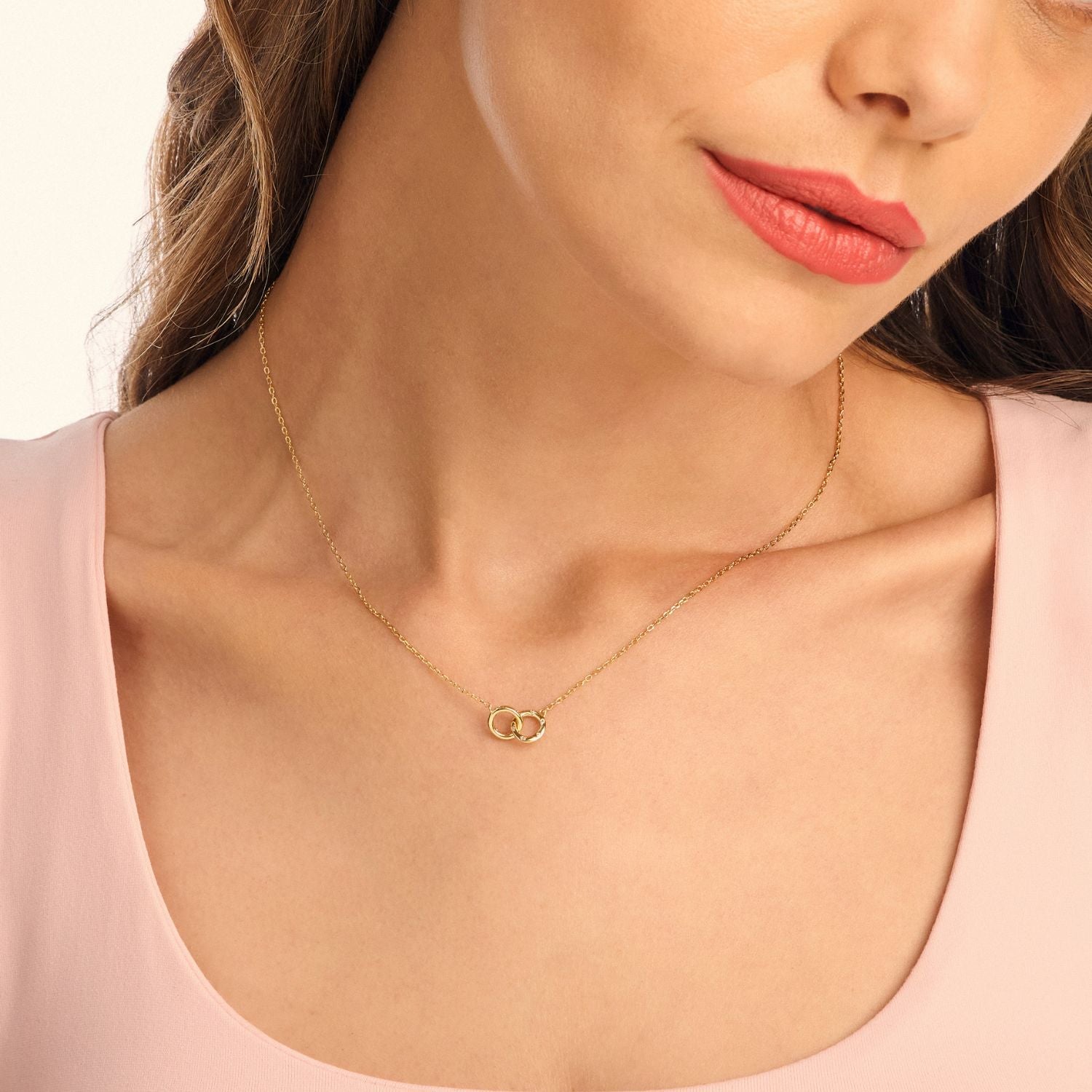 Halo Link Necklace worn on model, showcasing gold-plated sterling silver chain and sparkling cubic zirconia-adorned interlinked hoops