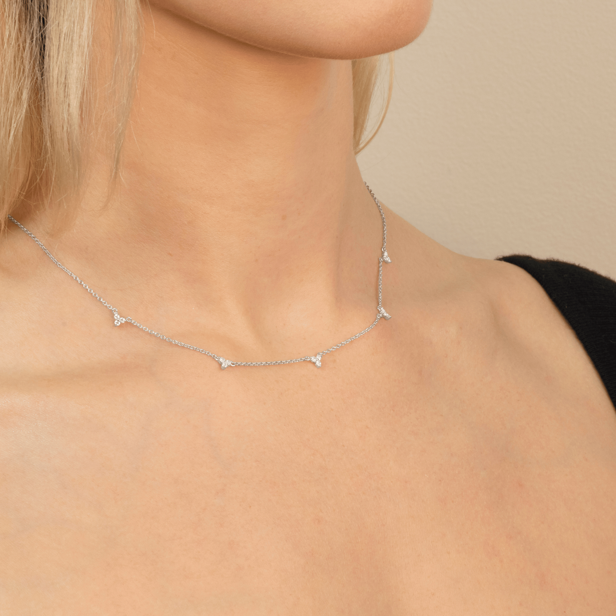 model wears lotus silver necklace