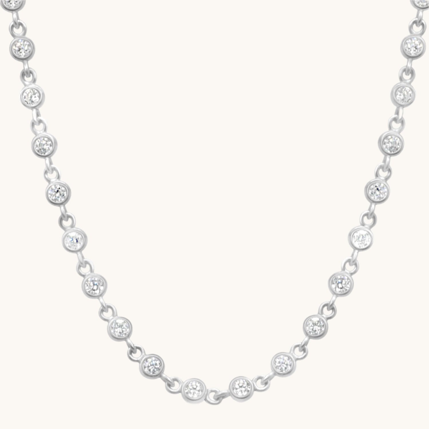 cubic zirconia chain necklace on cream background