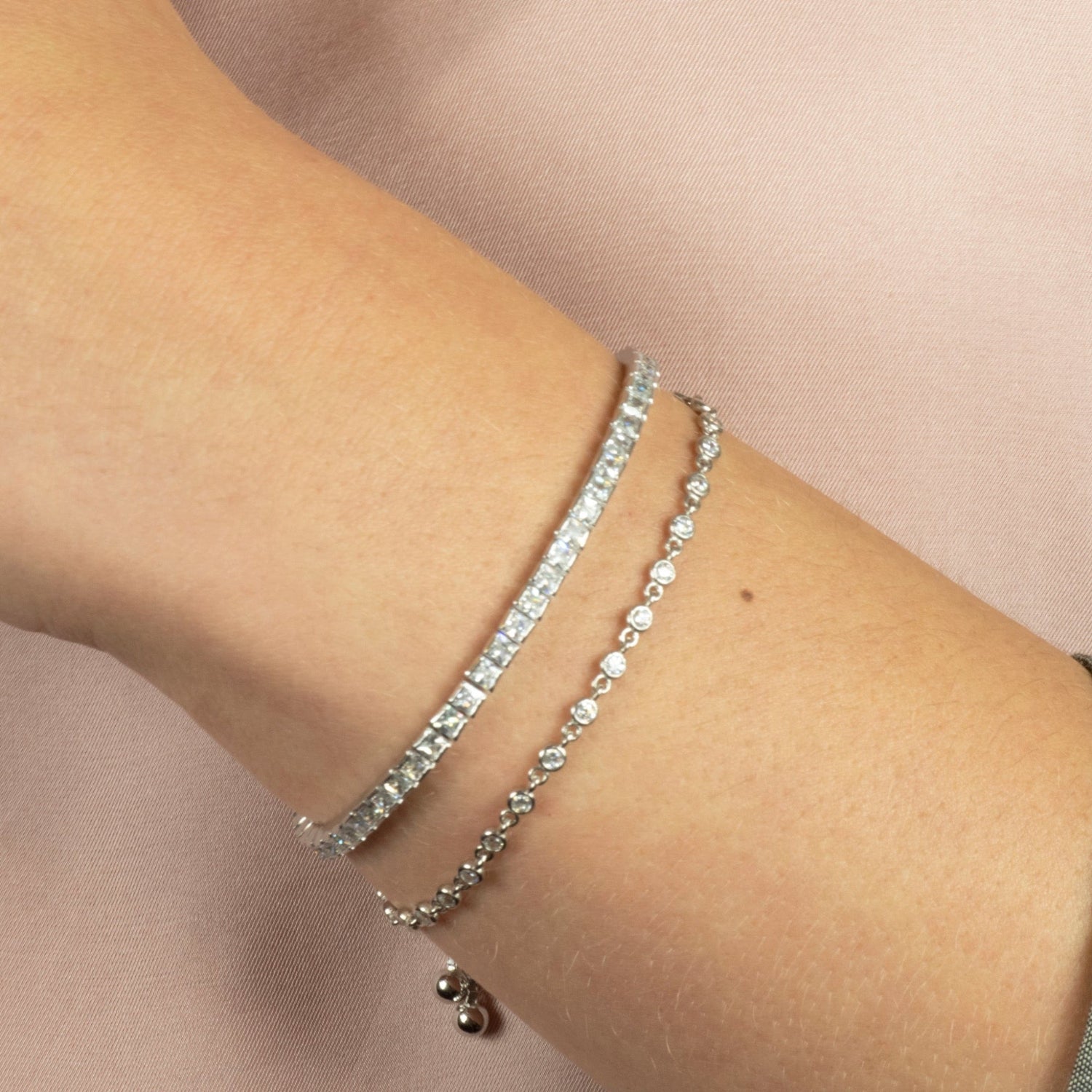 Model wearing the Diana silver chain bracelet with sparkling cubic zirconia accents, styled for everyday elegance.