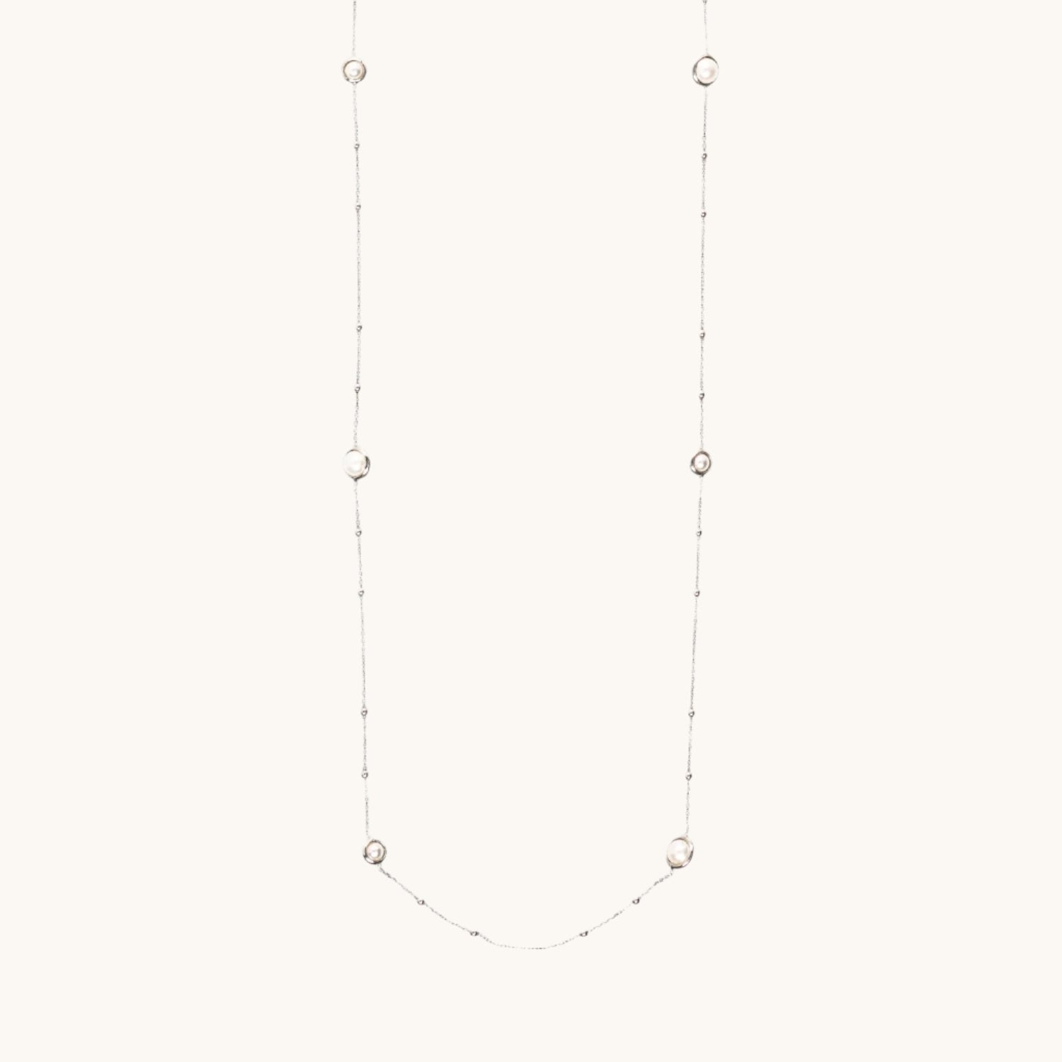 Pearl-Encased Bauble-Chain Necklace, image showing length of necklace on cream background