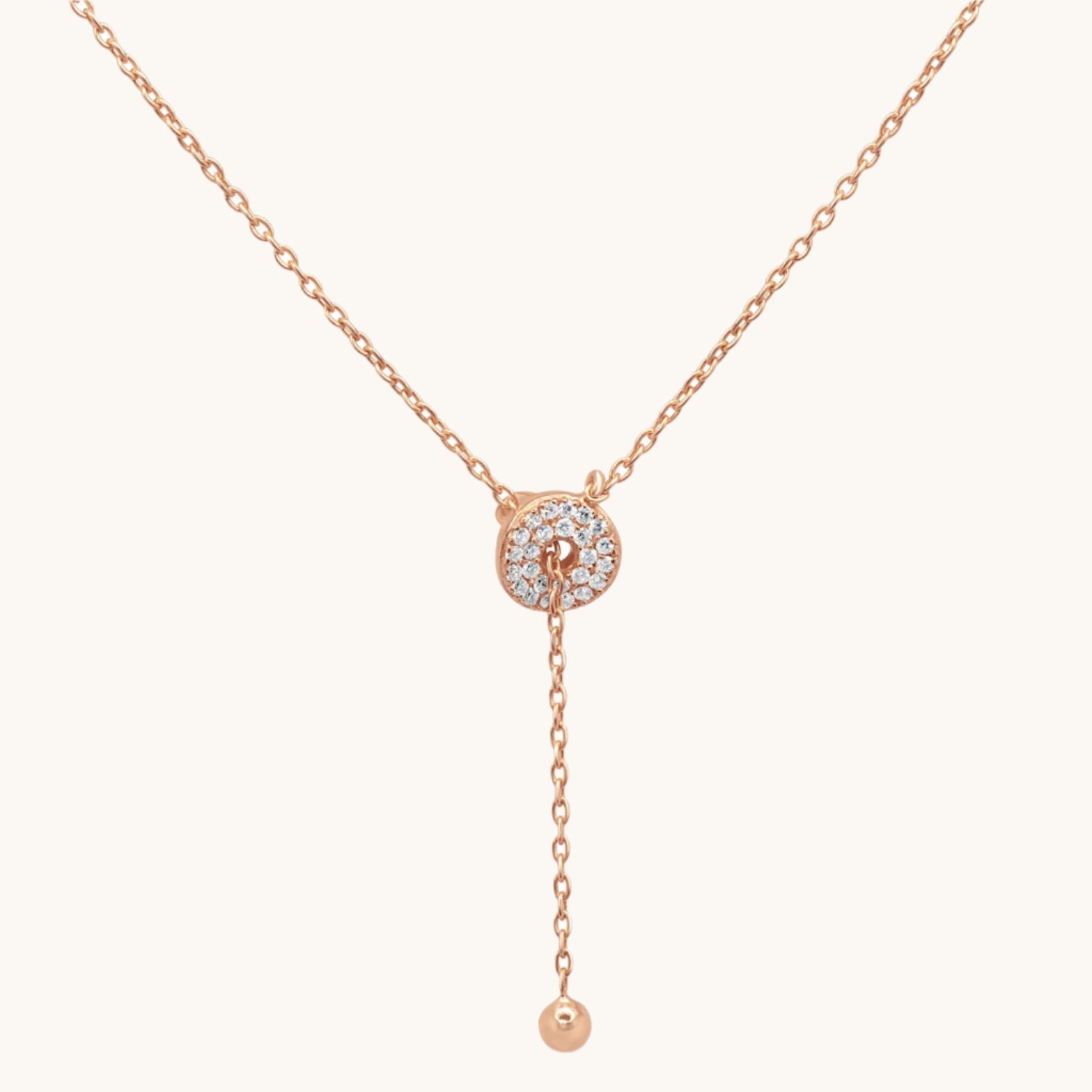 Stunningly Simple gold plated Lariat Necklace on cream background