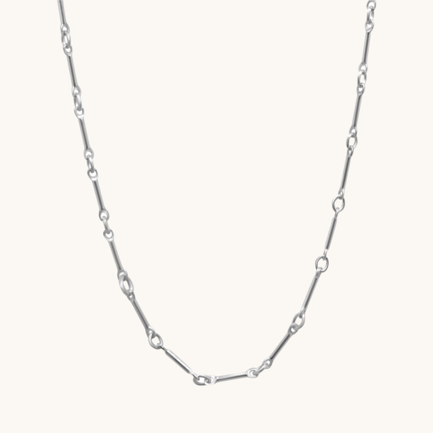 Sterling silver bar link long necklace flat lay on cream coloured background