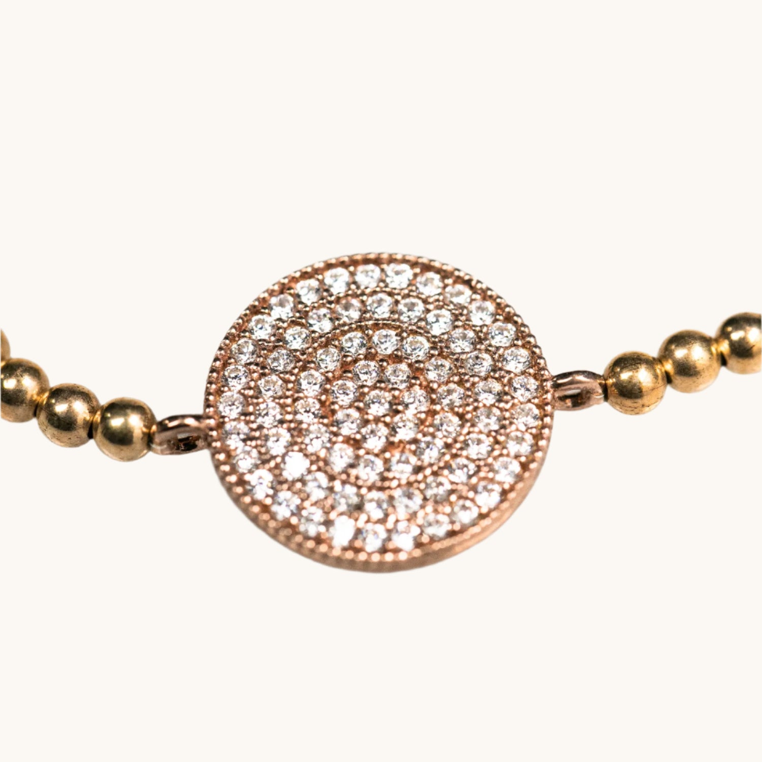 Close up of paved beaded bracelet with swarovski crystals in gold plated