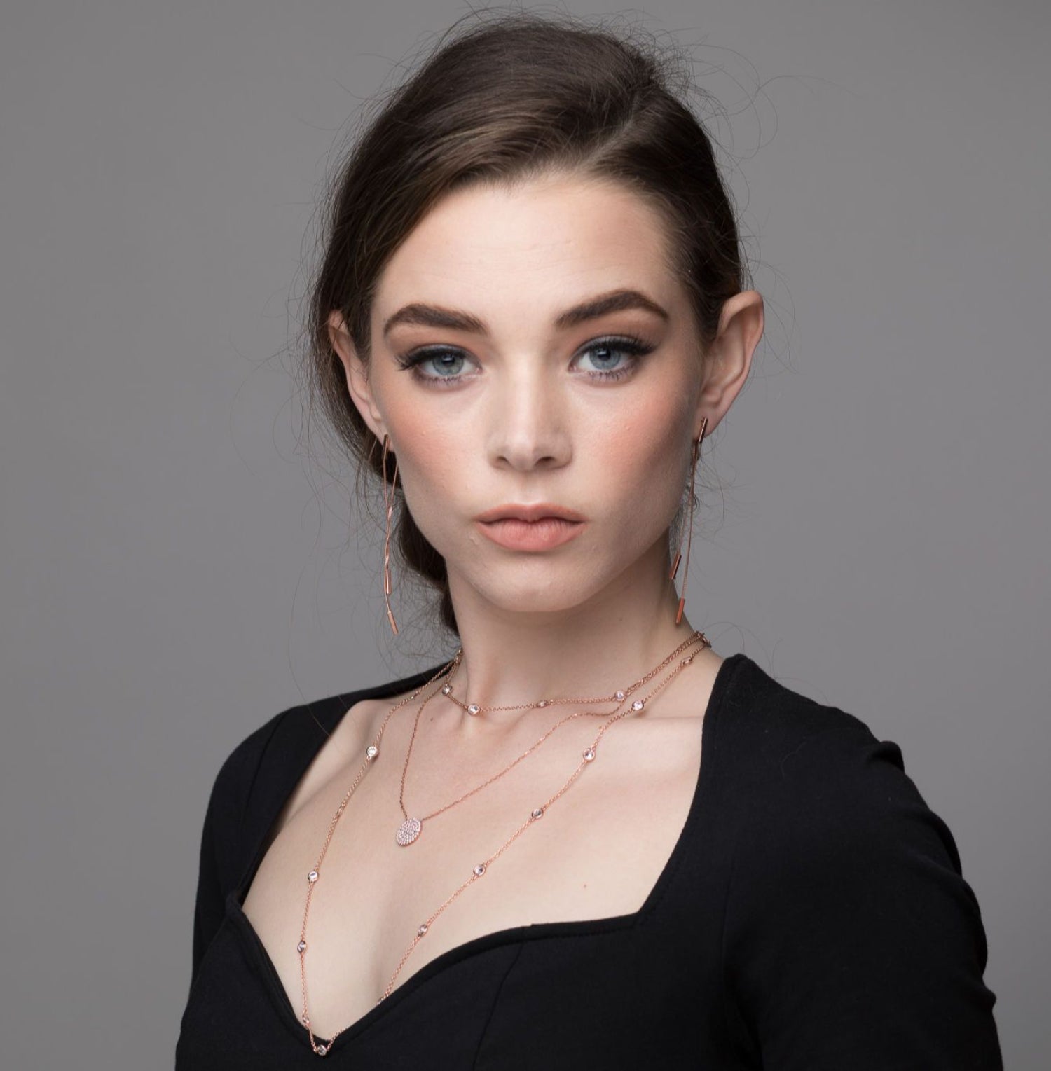 Model wearing Cubic Zirconia Circle Necklace in rose gold plated stacked with other pieces from the I Dream of Silver collection