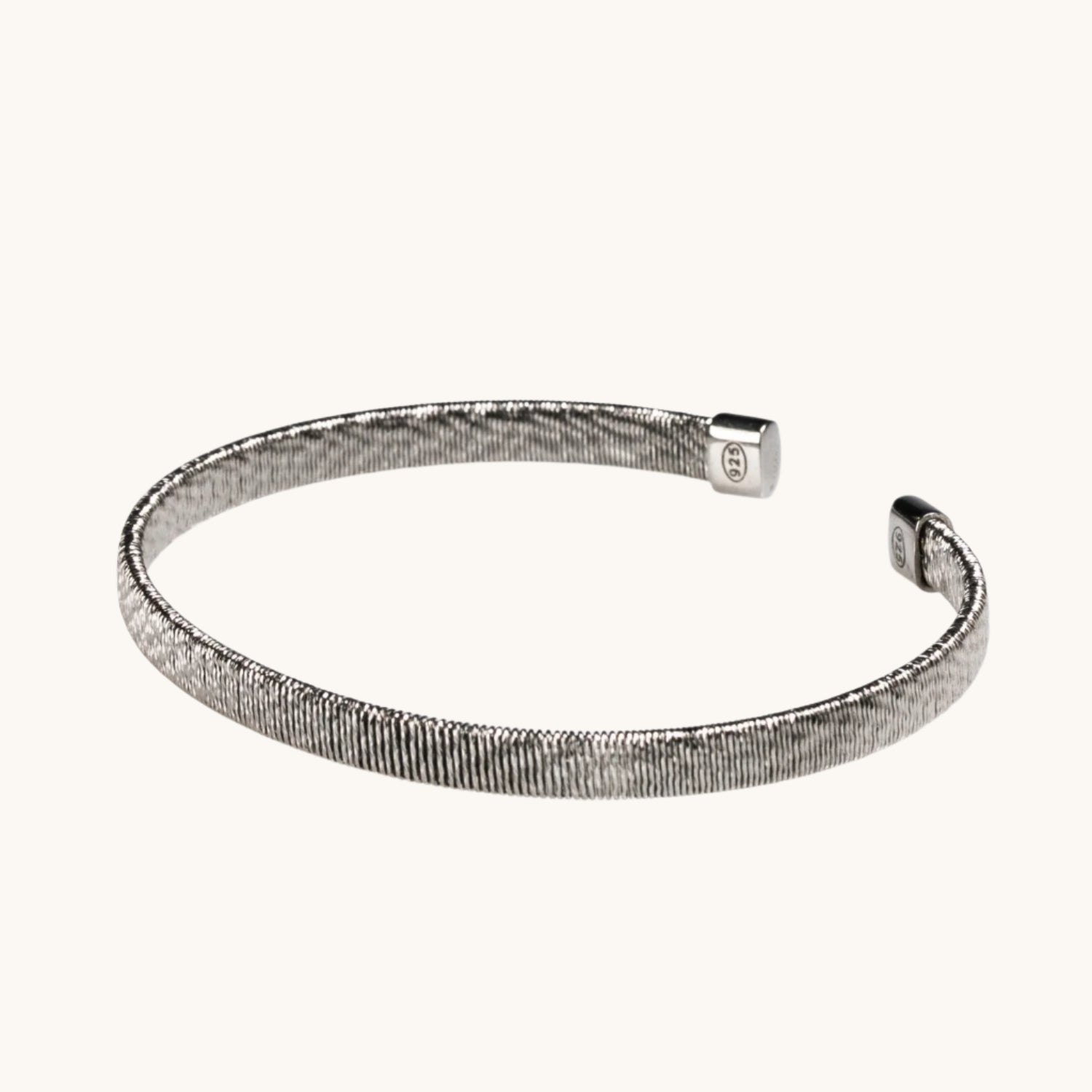 Elegant thick diamond-cut bangle showcasing a textured, faceted surface for added sparkle.